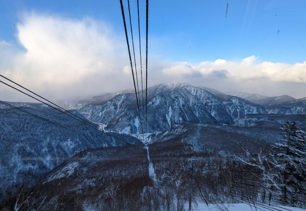 Heading down the ropeway with mountain in background